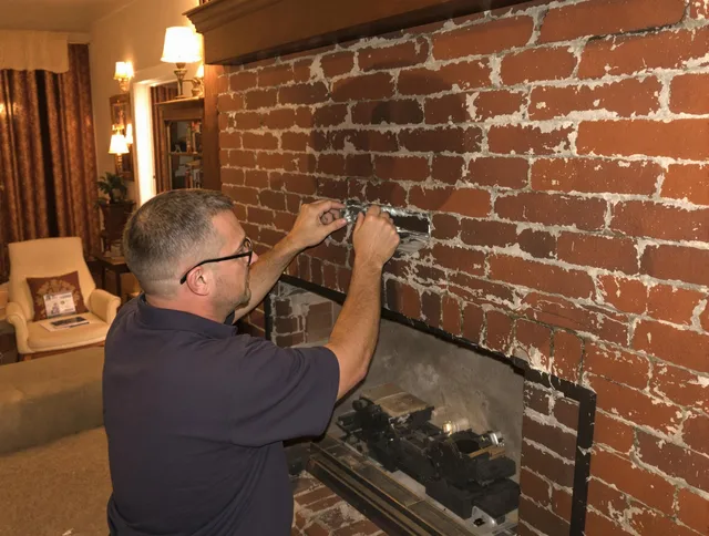 Carson Chimney Sweep expert fixing a fireplace in Carson, CA